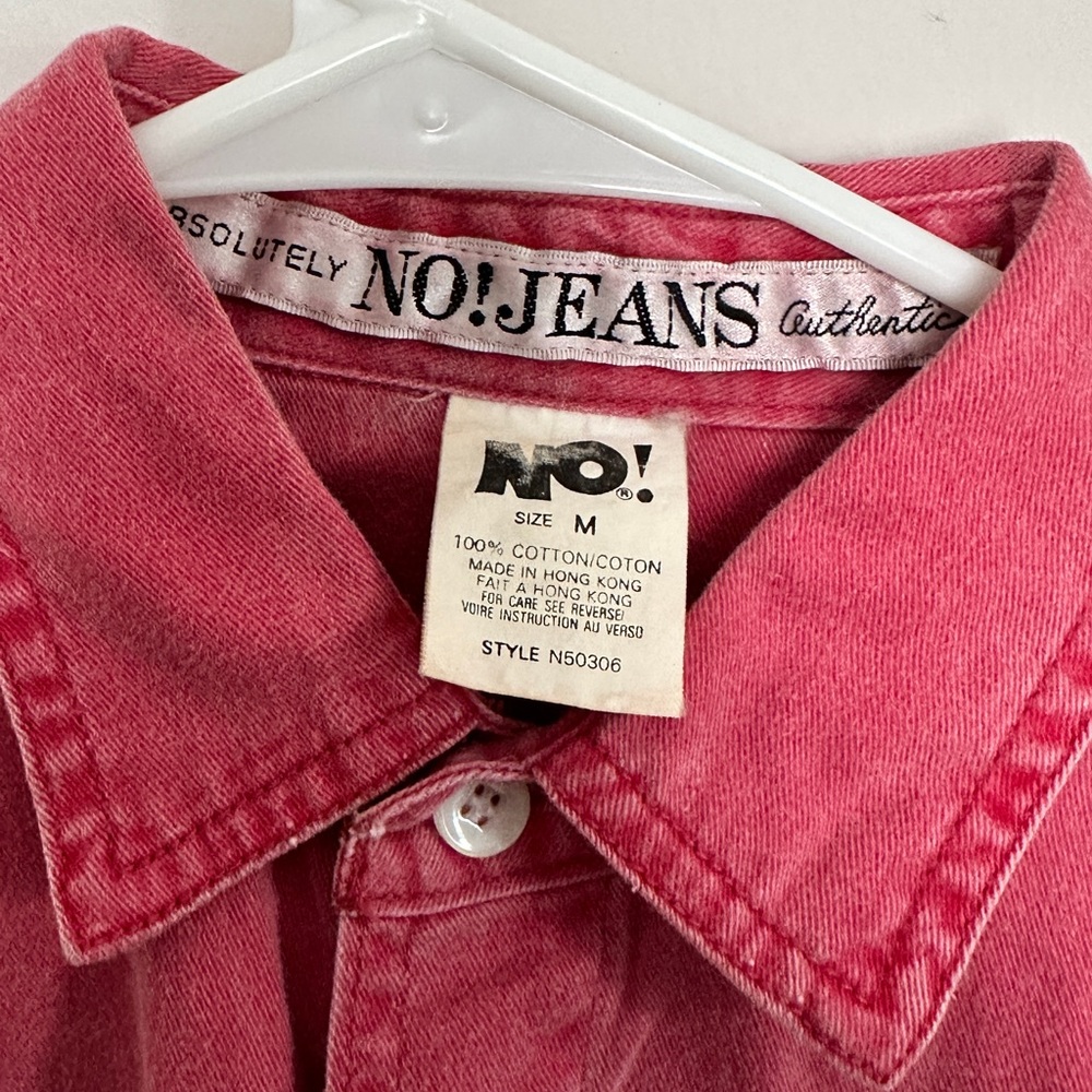 a pink thrifted, jean jacket
